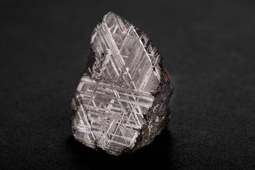 Close-up of a natural meteorite fragment showing crystalline Widmanstätten pattern used for the Nivada Grenchen F77 MK2 meteorite dial
