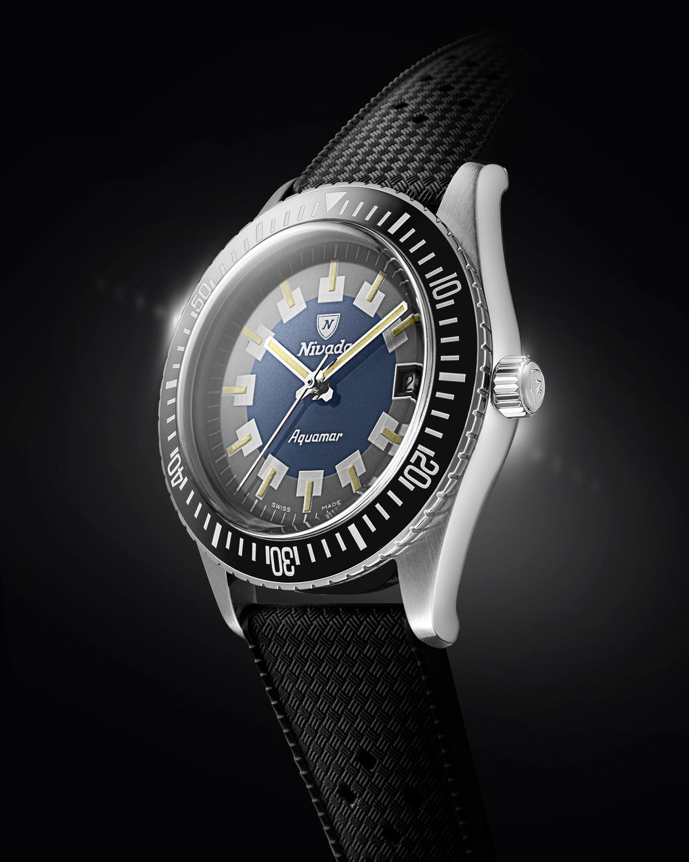Aquamar Vintage dive watch with blue and grey dial, black bezel and textured black strap, angled close-up