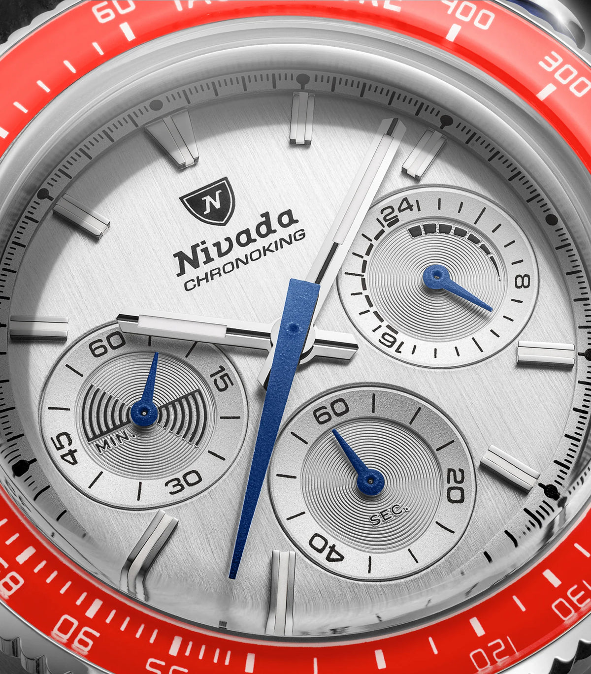 Nivada Grenchen Chronoking Mecaquartz Racing Grey macro of silver dial, blue hands and red bezel