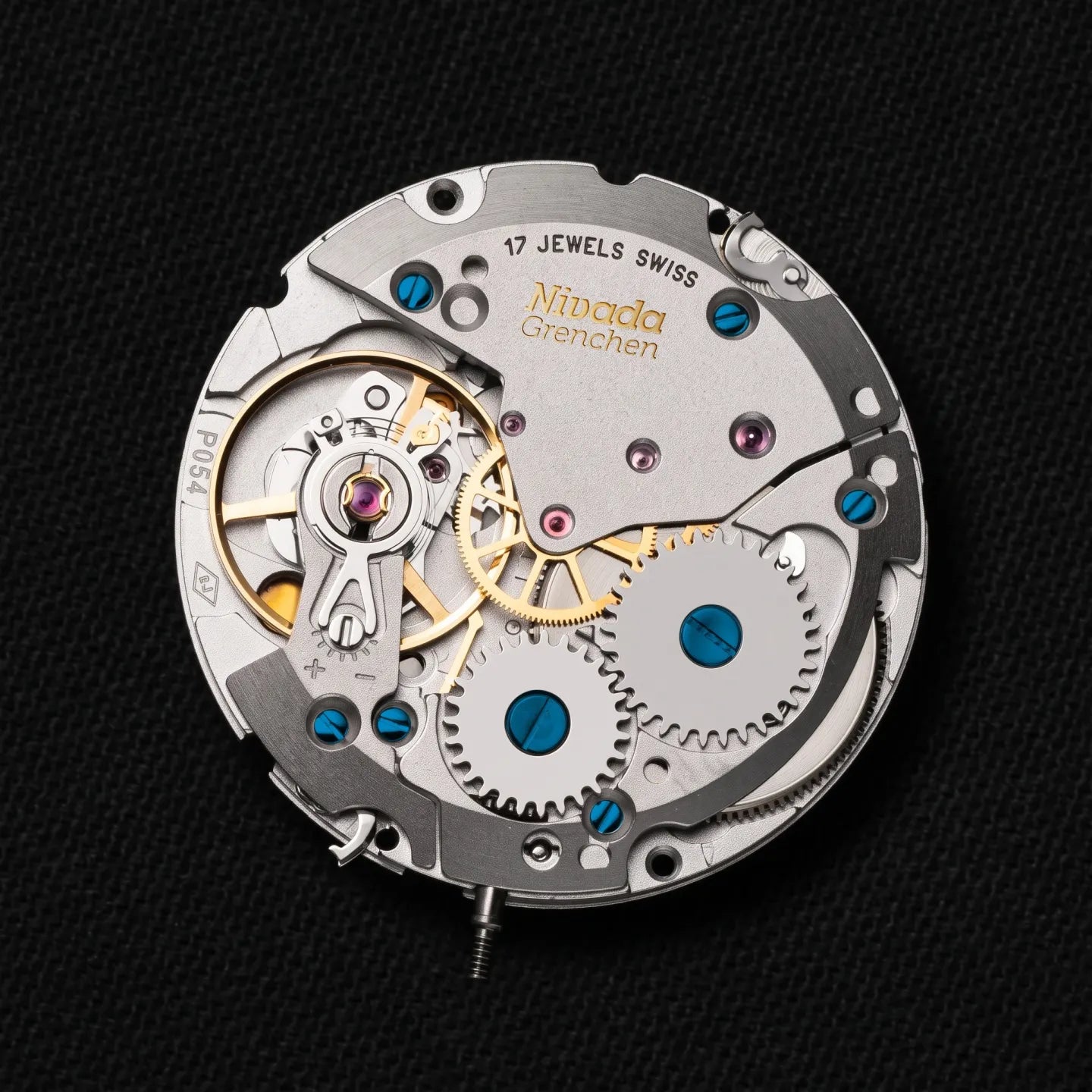 See-through caseback showing the modified Soprod P054 movement and the two golden penguins