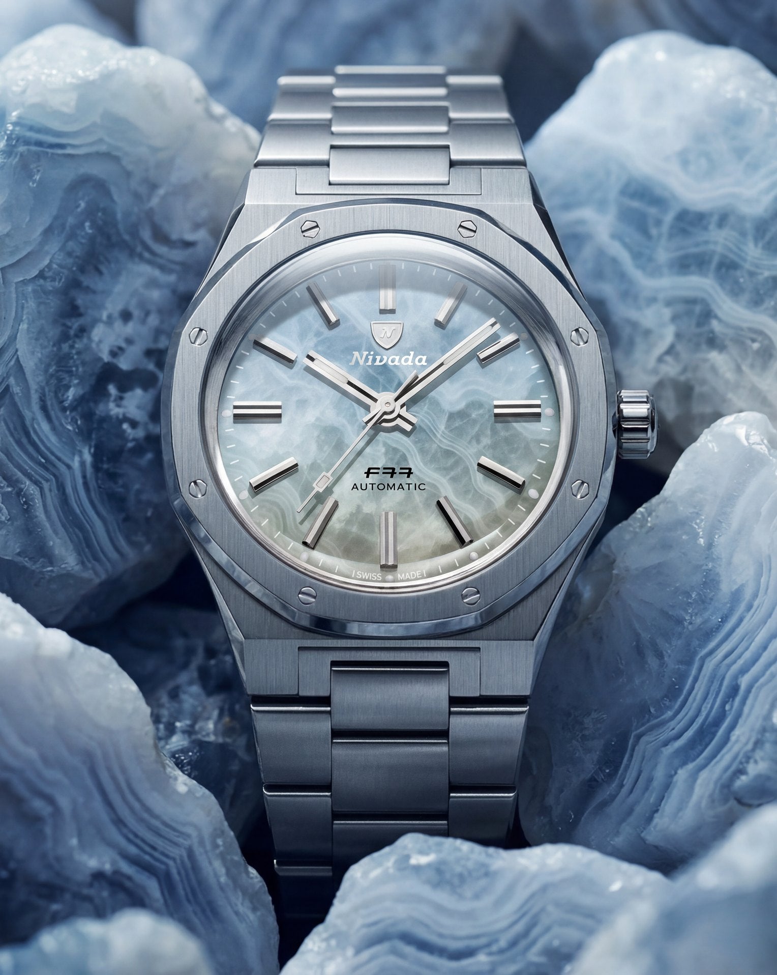 F77 MKII Ice Agate resting on pale mineral stone
